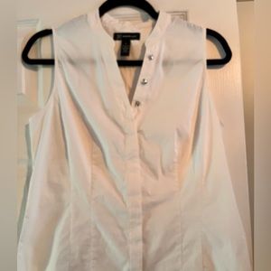 White sleeveless top.